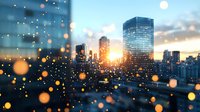 Dramatic urban sunset cityscape with glowing bokeh lights in foreground, modern skyscrapers silhouetted against golden sky. Dreamy atmospheric scene for business backgrounds.