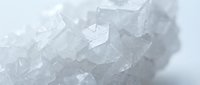 Crushed ice cubes with crystalline texture and translucent appearance, suitable for beverage, food, and culinary design projects.