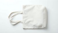 Blank white cotton tote bag with handles isolated on white background, ready for custom design, printing, branding, merchandise, and promotional use.