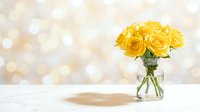 Fresh yellow roses in glass vase on white wooden table with soft bokeh background for home decor and floral arrangements.