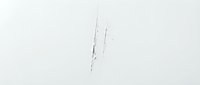 Minimalist aerial view of two figures walking through snow, creating subtle tracks on white landscape for winter travel and solitude concepts.