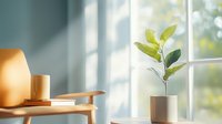 Minimalist home decor with green plant in ceramic pot on wooden shelf near window, soft natural light casting shadows, cozy interior design atmosphere.