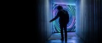 Person walking through futuristic tunnel with glowing purple and blue spiral portal, sci-fi corridor with neon lights creating mysterious atmosphere.