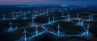 Aerial view of illuminated wind turbines connected by glowing network lines at night, representing renewable energy infrastructure and smart grid technology for sustainable power generation.