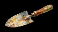 Watercolor garden trowel with rusty metal blade and wooden handle, isolated on transparent background. Great for stickers, t-shirt design, print on demand, and clipart.