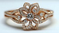 Elegant rose gold flower ring with diamonds and intricate petals design for luxury jewelry collection and romantic occasions.