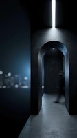 Dark modern interior hallway with arched doorway and dramatic lighting creating atmospheric shadows and depth for contemporary architecture design.