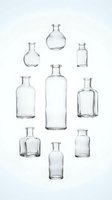 Collection of empty clear glass bottles in various shapes and sizes isolated on white background for product design and packaging concepts.