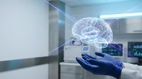 Surgeon hand holding holographic brain model in modern operating room for medical education and neurosurgery planning in healthcare technology.