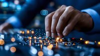 Businessman hand touching digital network connections with glowing data points representing modern technology and connectivity solutions.