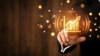 Close-up of businessman hand holding glowing holographic growth chart icon with upward arrow and financial data visualization, symbolizing business success and profit increase.