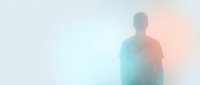 Silhouette of a man standing in misty atmosphere with blue and orange gradient light effects, isolated on white background for design projects.