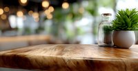Rustic wooden table surface with live edge detail, decorative glass jar and succulent plant in white pot against blurred bokeh restaurant background.