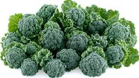 Fresh organic broccoli florets and leaves arranged in group composition on white background, isolated healthy vegetable for food design and packaging.