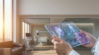 Smart home automation control tablet displaying holographic interface with IoT connectivity in modern living room for future technology applications.