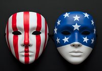 Two decorative masks with patriotic designs isolated on dark background. Left mask features red and white vertical stripes with black facial features. Right mask displays blue base with white stars and white lower face section. Both masks are ready for design projects, merchandise, and promotional materials.