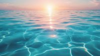 Tranquil turquoise ocean water surface with gentle ripples reflecting golden sunset light creating mesmerizing patterns. Serene seascape view for wellness and relaxation themes.
