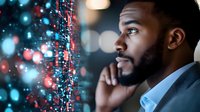Young African American businessman analyzing digital data visualization with glowing network connections and bokeh lights in modern office environment.