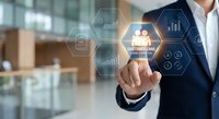 Professional businessman touching customer care icon on digital interface with business analytics symbols in modern office environment.