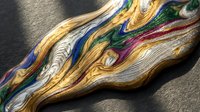 Colorful embroidery threads in vibrant hues creating flowing waves on textured surface for crafting and needlework projects.