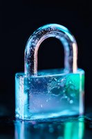 Glowing transparent padlock with blue and turquoise neon lighting effect on dark background, water drops and reflective surface create cybersecurity concept.