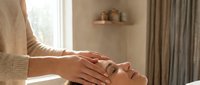 Professional spa facial massage therapy session with relaxing hands-on treatment for skincare wellness and beauty rejuvenation in serene salon environment.