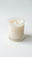 Luxury white scented candle in glass jar with cotton wick on clean white background for home decor and aromatherapy relaxation.