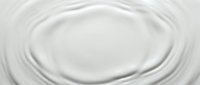 Smooth white liquid swirls in circular motion, creating ripple patterns ideal for cosmetics, skincare, and beauty product backgrounds.