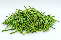 Fresh green string beans pile isolated on white background, raw organic vegetables for healthy cooking and food preparation.
