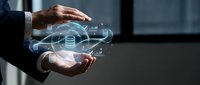 Businessman hands protecting holographic cloud computing network with database icons and digital connections for data storage and cybersecurity solutions.