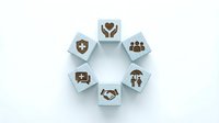 Wooden blocks arranged in a circle with healthcare and insurance icons on white background, representing medical protection and family care concepts.
