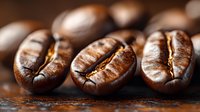 Macro shot of roasted coffee beans showing detailed texture and rich brown color on dark background, highlighting natural grooves and aromatic appearance for food industry use.
