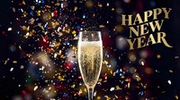 Sparkling champagne flute with colorful confetti and golden Happy New Year text on dark festive background for holiday celebration.