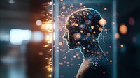 Glowing human head silhouette with floating light particles against dark background, representing consciousness, mind and artificial intelligence technology.