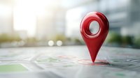 Red location pin marker on city map with blurred urban background, symbolizing navigation and destination point for travel and business services.