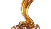 Liquid golden honey or caramel pouring and dripping with smooth, glossy texture isolated on white background for design, packaging, and food advertising use.