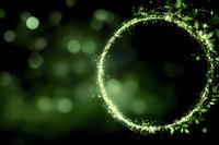 Magical glowing green circle frame with sparkles and leaves on dark bokeh background, mystical nature portal effect for fantasy designs.