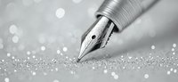 Elegant fountain pen nib with silver metallic finish against sparkling bokeh background in monochrome. Macro photography captures intricate details and reflective surface.