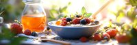 Healthy breakfast bowl with fresh berries, nuts and honey on wooden table in morning sunlight for nutritious meal and wellness lifestyle concepts.