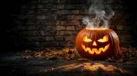 Carved jack-o-lantern pumpkin with glowing face and smoke emanating from top against dark brick wall with autumn leaves scattered around for Halloween celebrations and seasonal decorations.