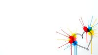 Colorful abstract burst design with radiating lines and heart shape on white background for creative projects and artistic presentations.