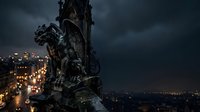 Ornate stone gargoyle statue perched on cathedral tower overlooking illuminated cityscape at dusk, dramatic cloudy sky, gothic architecture detail for editorial and design projects.