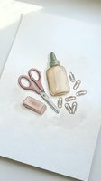 Watercolor office supplies illustration with scissors, glue bottle, eraser and paper clips on white paper for stationery and craft projects.