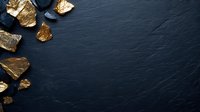 Raw gold nuggets and pieces scattered on dark slate stone background with copy space, luxury mineral concept for jewelry and investment.