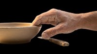 Mature male hand holding wooden bowl with brush, isolated on transparent background. Ready for design use on t-shirts, clipart, stickers, print-on-demand products, and sublimation projects.