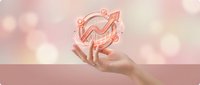 Hand holding glowing pink growth chart with upward arrow, financial success concept on soft bokeh background for business presentations.