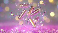 Floating metallic pink and gold pills with scattered confetti and sparkles on blurred bokeh background in pink and purple tones. Pharmaceutical concept.