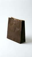 Brown paper shopping bag isolated on white background for retail packaging and eco-friendly commerce designs.