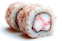Fresh sushi roll with white rice and crab meat filling, garnished with pink and red surimi, close-up macro shot showing texture and layers.