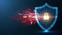 Digital shield protecting against cyber attack with glowing padlock and red malware fragments on dark blue background for cybersecurity concepts.